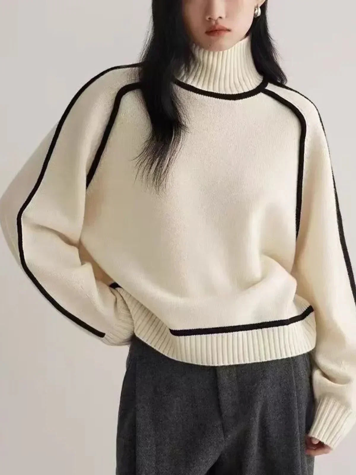 White wool turtleneck sweater for women featuring a luxe edge trim, designed by Christine Brewer for autumn wear.