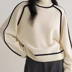 White oversized turtleneck sweater by Christine Brewer with luxe wool edge trim, perfect for autumn, featuring a tailored, versatile design.