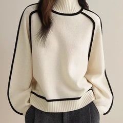 White oversized turtleneck sweater by Christine Brewer with luxe wool edge trim, perfect for autumn, featuring a tailored, versatile design.