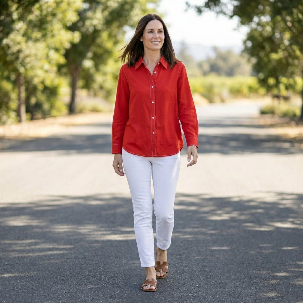 Women’s summer blouse by Christine Brewer, linen button-front top worn in a casual lifestyle setting.