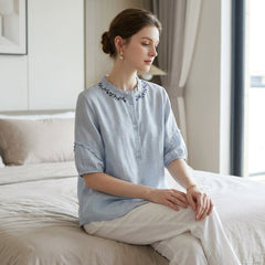 Women’s summer linen blouse with ruffles, stylish Christine Brewer top perfect for warm weather and casual wear.