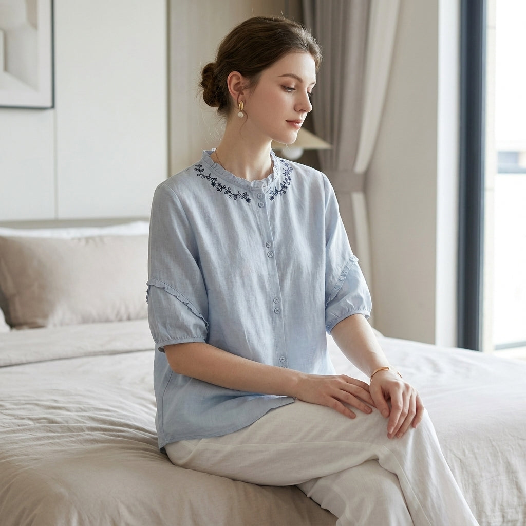 Women’s summer linen blouse with ruffles, stylish Christine Brewer top perfect for warm weather and casual wear.