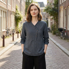 Women wearing Christine Brewer summer blouse with geometric long sleeves, stylish top perfect for warm weather and casual outings.