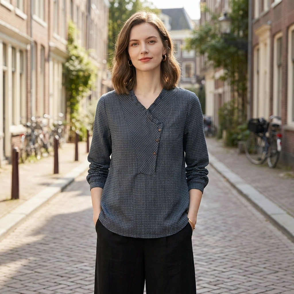 Women wearing Christine Brewer summer blouse with geometric long sleeves, stylish top perfect for warm weather and casual outings.