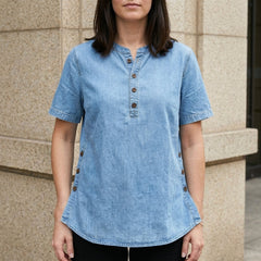 Light blue denim women's summer top with button front by Christine Brewer, featuring a casual and stylish design.