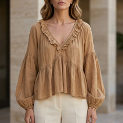 Light brown women's summer blouse with v-neck, long sleeves, and denim ruffle detail by Christine Brewer.