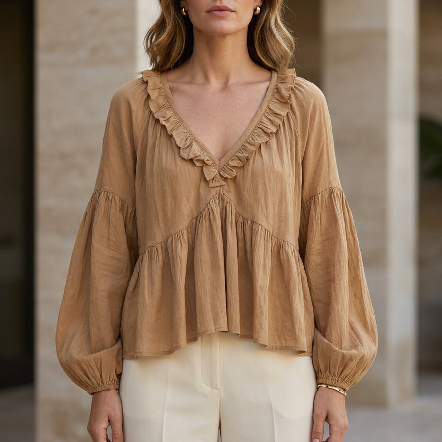 Light brown women's summer blouse with v-neck, long sleeves, and denim ruffle detail by Christine Brewer.