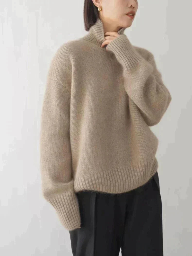 Khaki turtleneck sweater for women by Christine Brewer, featuring a cozy fit and ribbed collar, displayed on a neutral background.