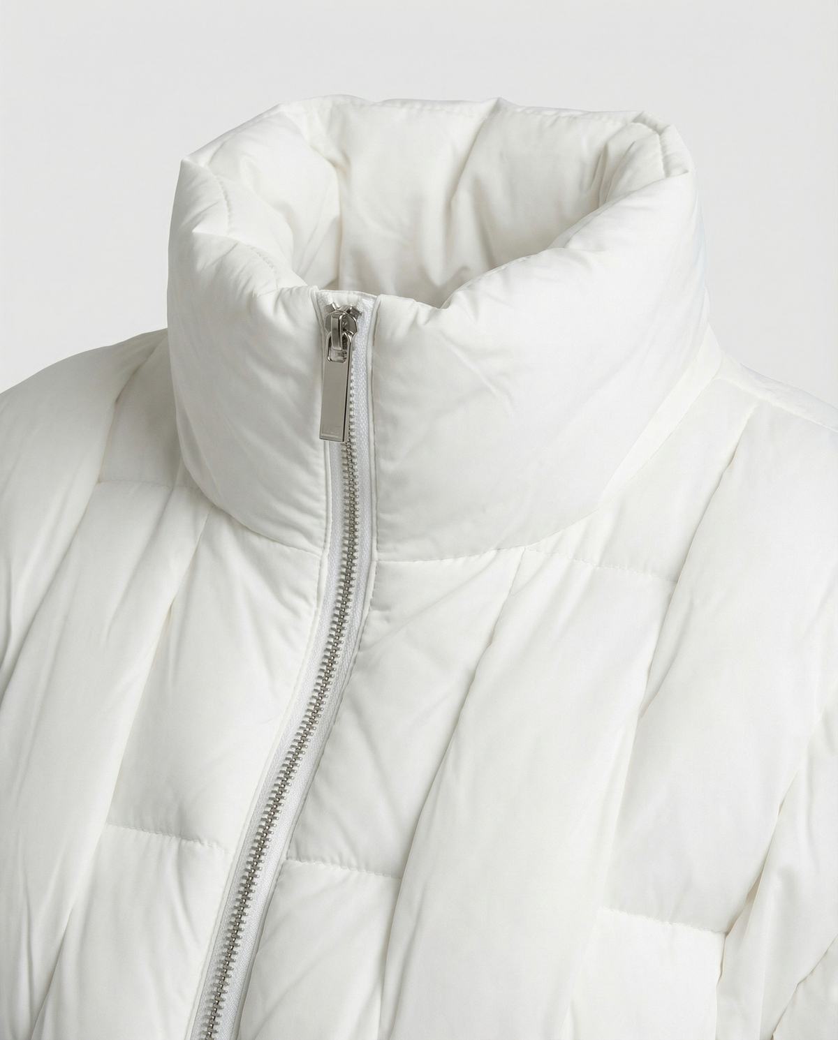 Close-up of the Clara Cosy Puffer Jacket for Women by Christine Brewer, showing the textured fabric and detailed stitching.