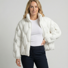 Woman wearing the Clara Cosy Puffer Jacket for Women by Christine Brewer, showing the upper body and stylish puffer design.