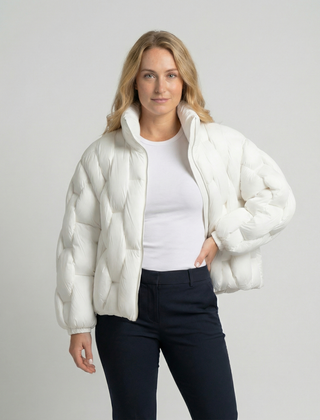 Woman wearing the Clara Cosy Puffer Jacket for Women by Christine Brewer, showing the upper body and stylish puffer design.