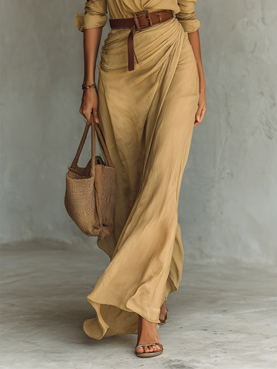 Long sleeve maxi dress for women by Christine Brewer, flowing fabric, fitted waist, and elegant design, perfect for casual or formal wear.