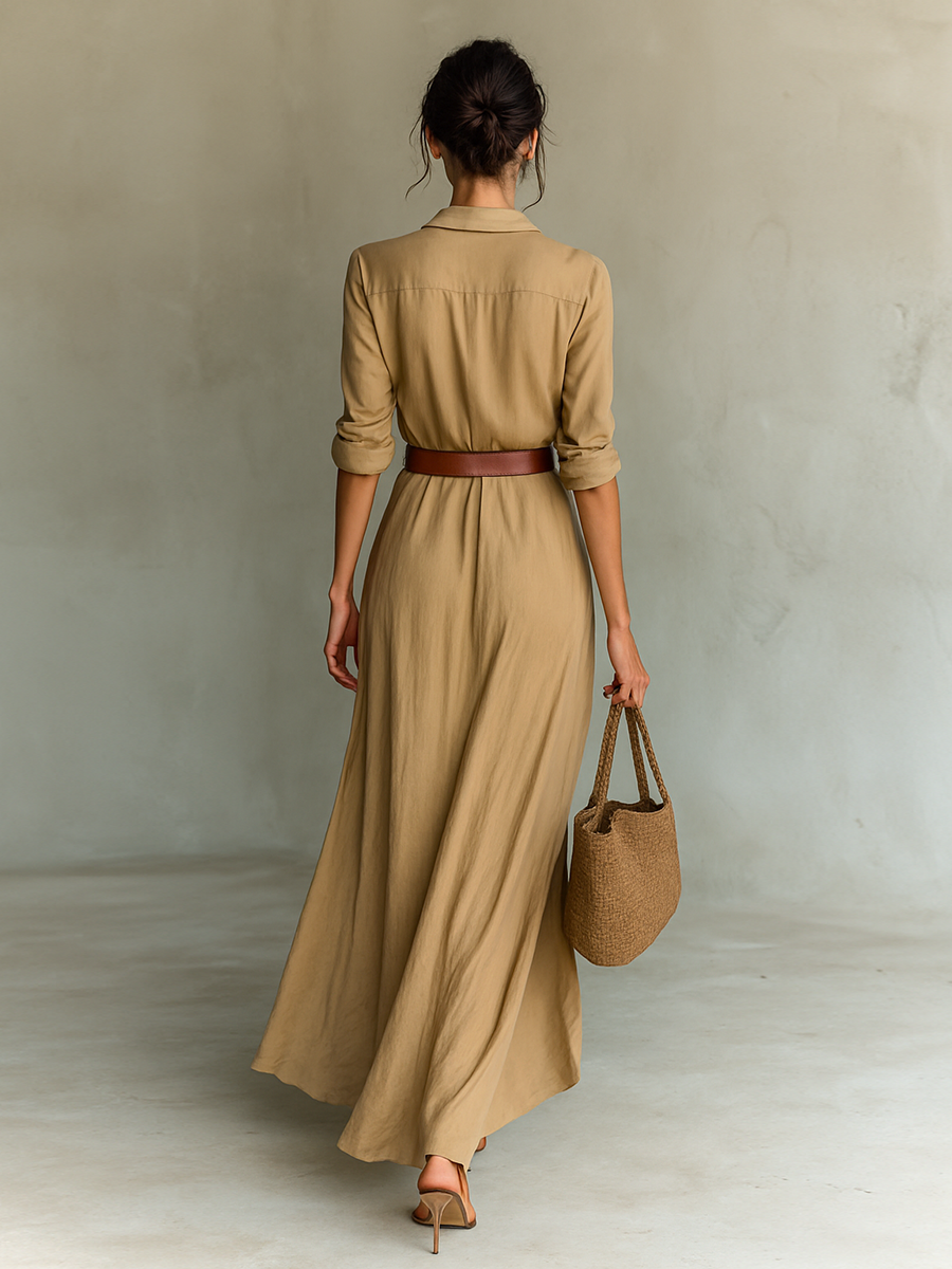 Long sleeve maxi dress for women by Christine Brewer, flowing fabric, elegant design, shown on a model.