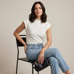 Women’s high neck cap sleeve summer top by Christine Brewer, worn by a model, featuring a stylish and lightweight design.