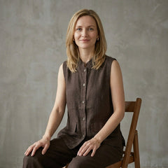 Women’s sleeveless denim summer blouse with button front, styled on a model, by Christine Brewer.