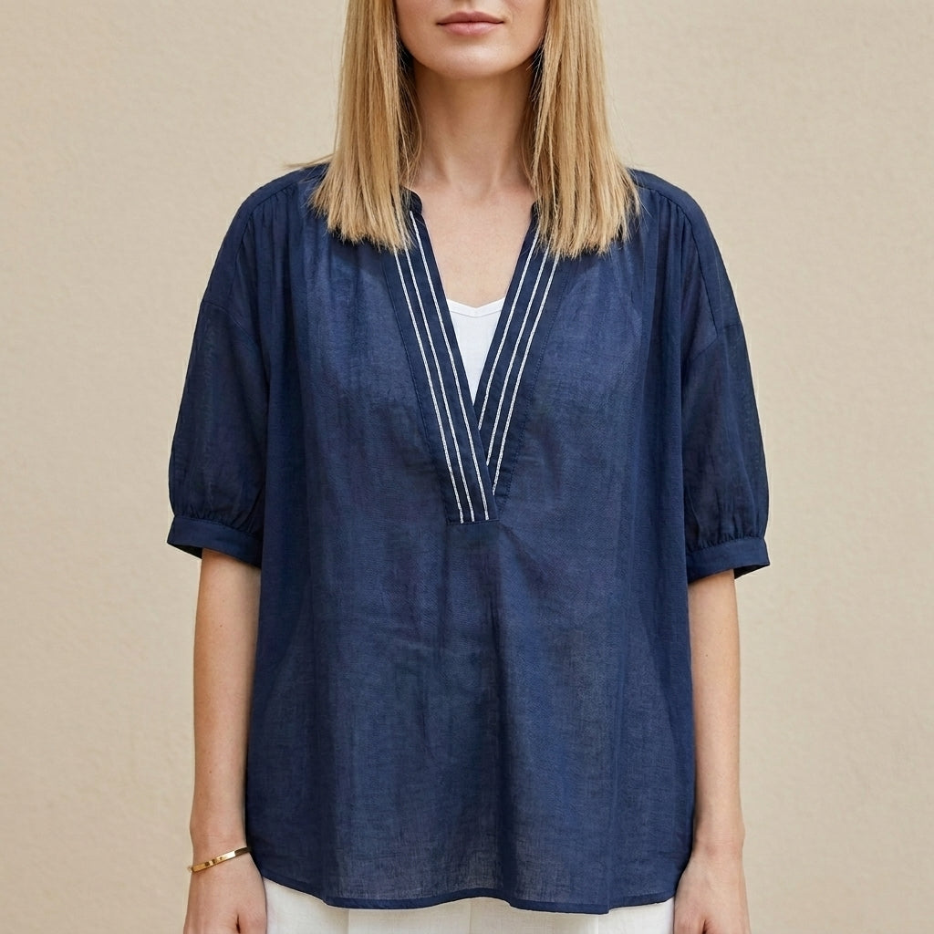 Navy blue women's summer blouse with V-neck and puff sleeves, stylish top by Christine Brewer, perfect for warm weather.