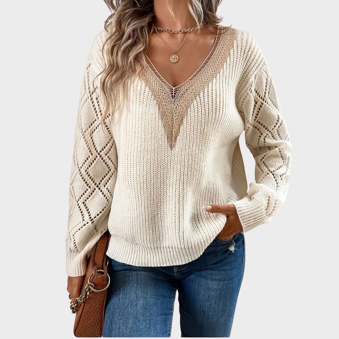 Beige V-neck sweater for women from Christine Brewer's Jenna collection, shown on a model with long hair and casual style.
