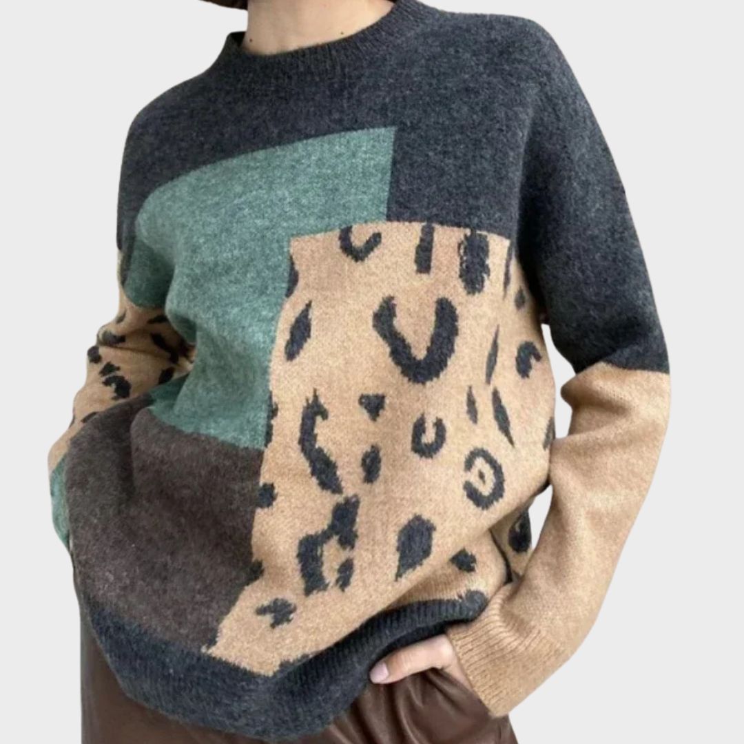 Heather leopard print graphic sweater for women by Christine Brewer, showing a cozy knit sweater with bold animal print design.