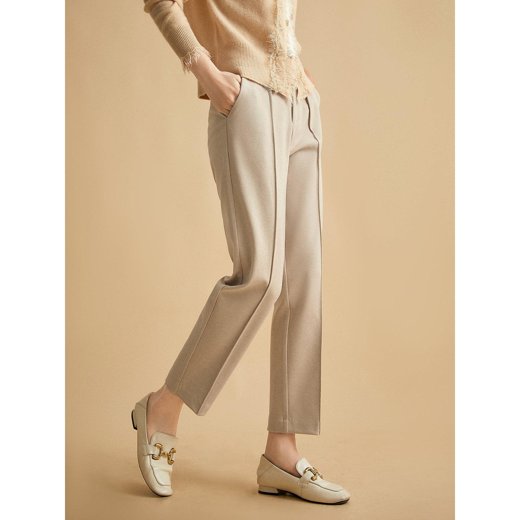 Women’s wool tapered trousers by Christine Brewer, featuring a tailored fit in soft merino wool fabric.