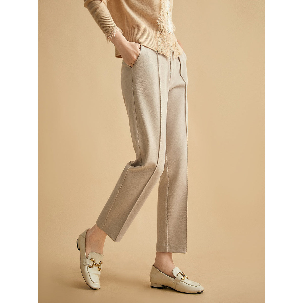 Women’s wool tapered trousers by Christine Brewer, featuring a tailored fit in soft merino wool fabric.
