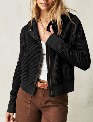 Women’s cropped hooded hoodie by Christine Brewer featuring a relaxed fit and front pocket, in soft fabric with a drawstring hood.