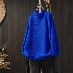 Cream-colored knit sweater for women by Christine Brewer, featuring a cozy Jade design with a textured pattern.