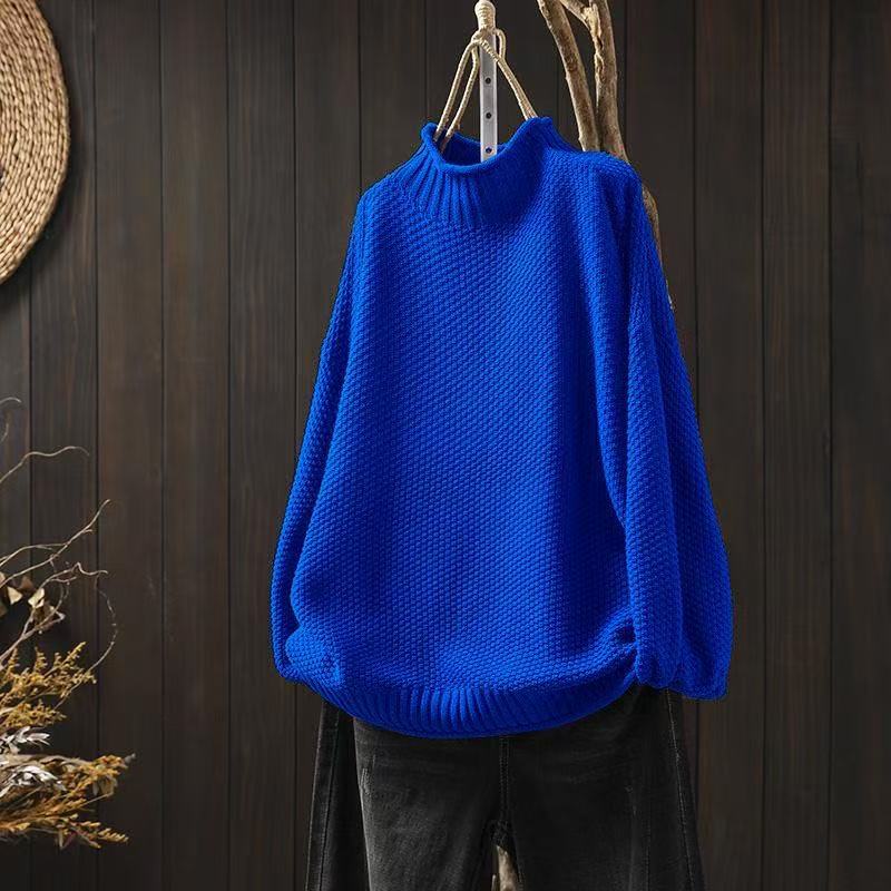 Cream-colored knit sweater for women by Christine Brewer, featuring a cozy Jade design with a textured pattern.