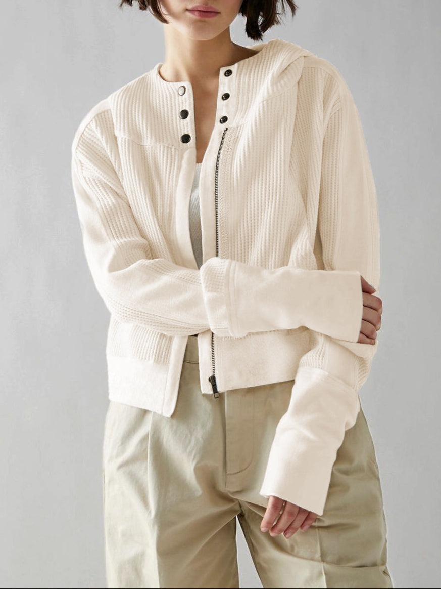 Mia cropped hooded hoodie for women by Christine Brewer, shown in black with front pocket and adjustable drawstrings.