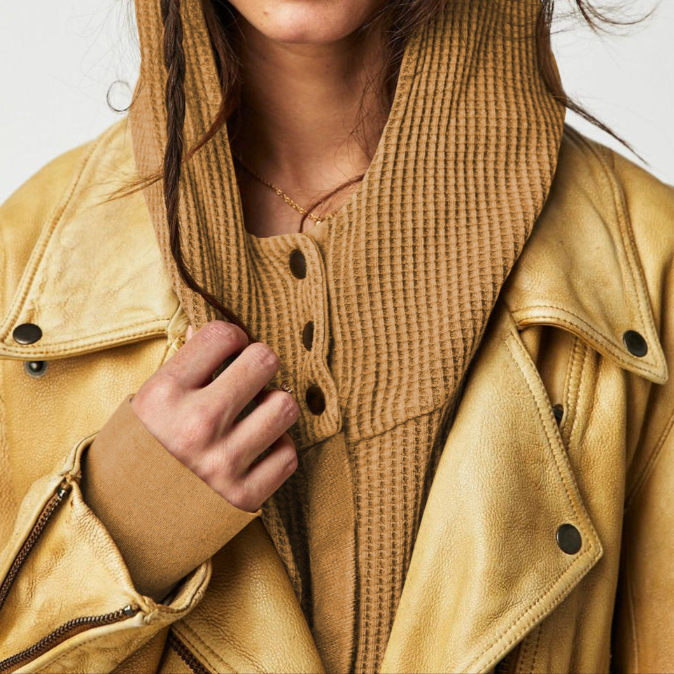 Pink cropped hooded hoodie for women by Christine Brewer, featuring a front pocket and adjustable drawstrings.