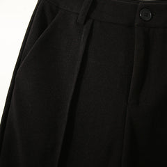 Women’s wool tapered trousers by Christine Brewer, stylish and comfortable Merino pants for women, shown in natural fabric detail.