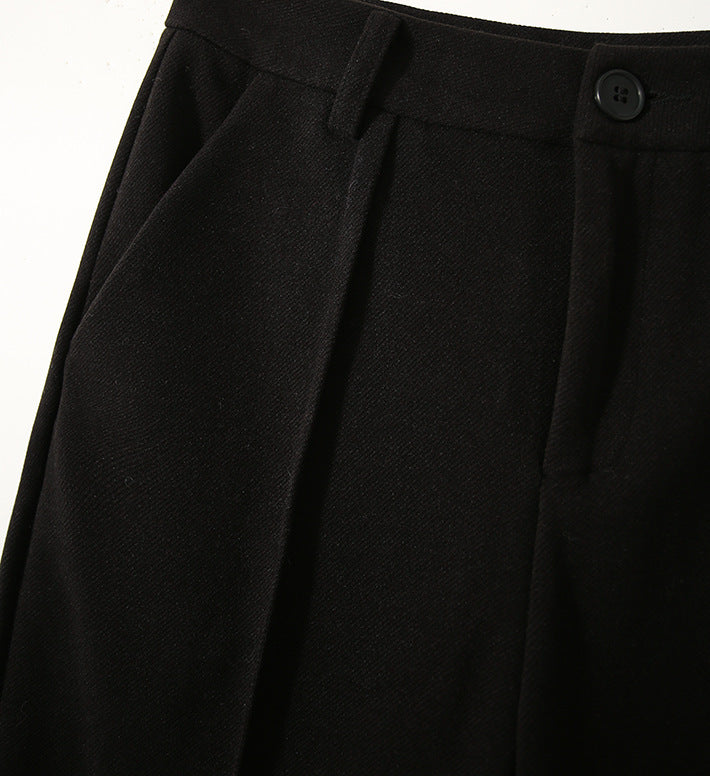 Women’s wool tapered trousers by Christine Brewer, stylish and comfortable Merino pants for women, shown in natural fabric detail.