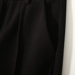 Women's wool tapered trousers by Christine Brewer, featuring a comfortable fit and classic design in neutral wool fabric.