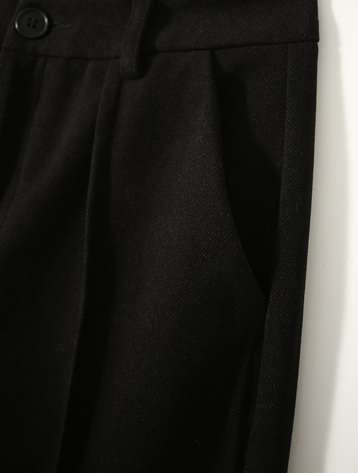 Women's wool tapered trousers by Christine Brewer, featuring a comfortable fit and classic design in neutral wool fabric.