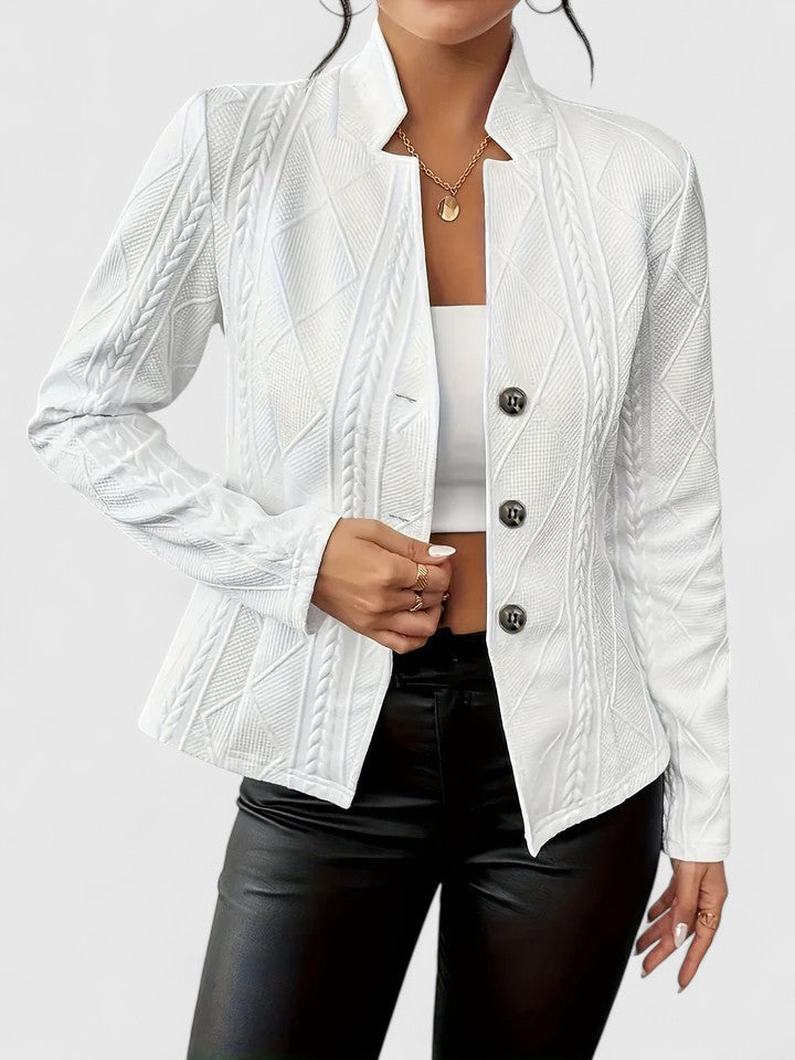 Elegant Maurelle jacket by Christine Brewer, featuring a tailored design and stylish details in a sophisticated outdoor setting.