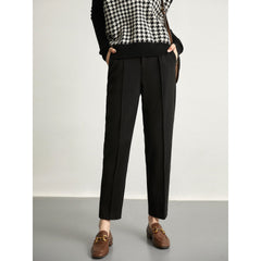 Women's wool tapered trousers by Christine Brewer, featuring a tailored fit and classic style in soft merino wool fabric.