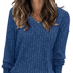 Oversized V-neck sweater for women by Christine Brewer, featuring a relaxed fit and soft knit fabric in a neutral color.
