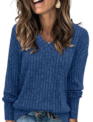 Oversized V-neck sweater for women by Christine Brewer, featuring a relaxed fit and soft knit fabric in a neutral color.