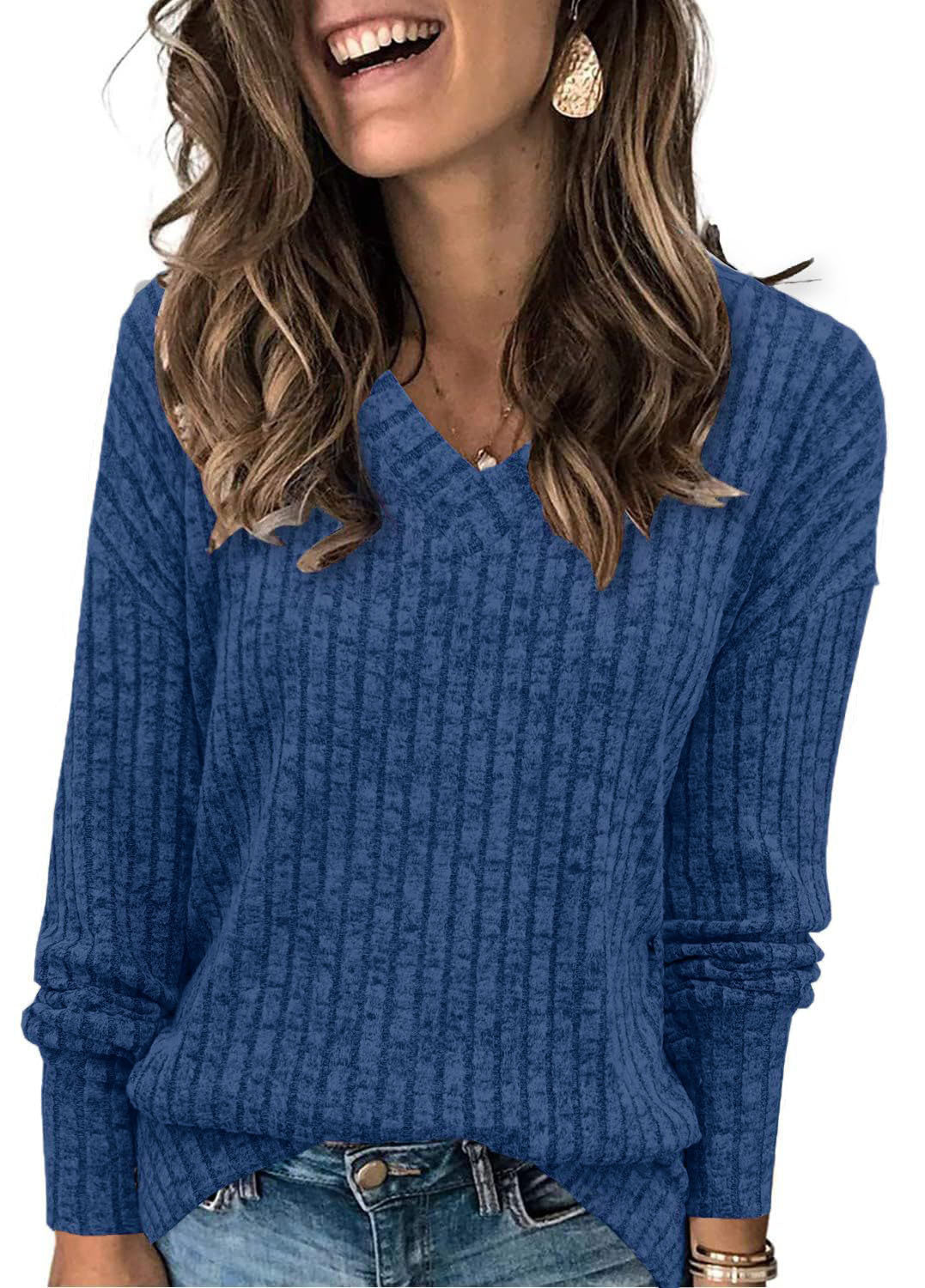 Oversized V-neck sweater for women by Christine Brewer, featuring a relaxed fit and soft knit fabric in a neutral color.