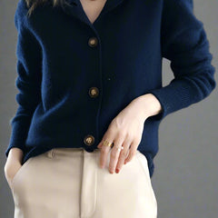 Christina women's cashmere high neck cardigan by Christine Brewer, soft beige color, close-up of cozy knit fabric and high neckline.