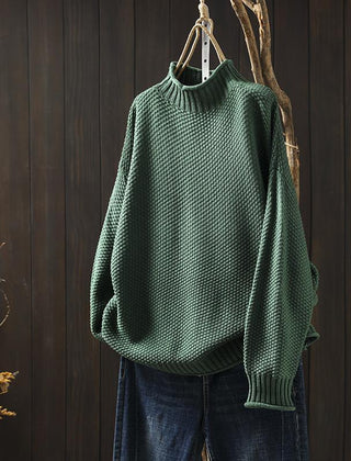 Women’s jade knit sweater by Christine Brewer featuring a cozy, fitted design with long sleeves and a round neckline.