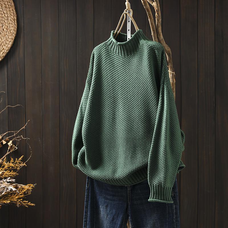 Women’s jade knit sweater by Christine Brewer featuring a cozy, fitted design with long sleeves and a round neckline.