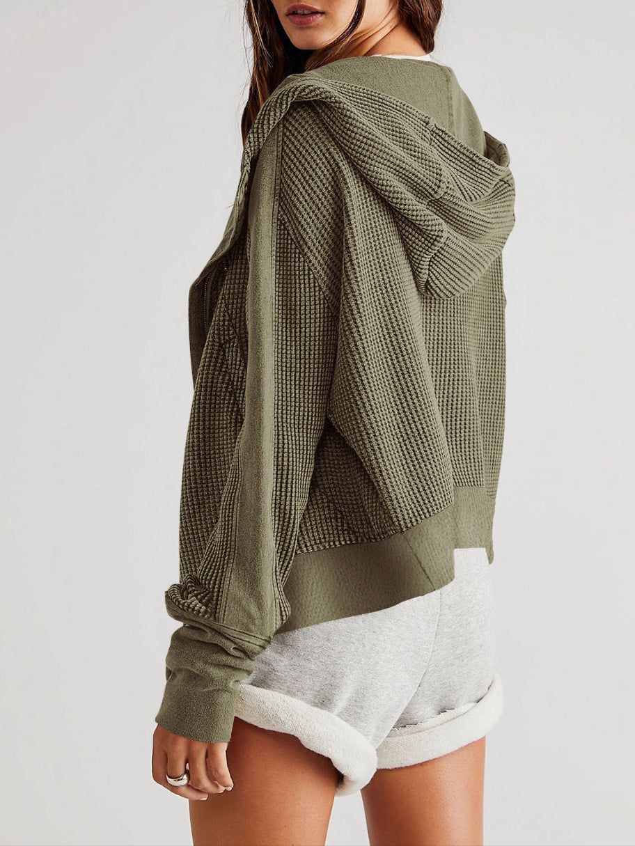 Mia cropped hooded hoodie for women by Christine Brewer, shown in gray with a front pocket and adjustable drawstrings.