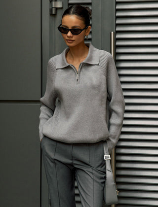 Cream-colored knit sweater for women by Christine Brewer featuring a cozy, textured design and a relaxed fit.