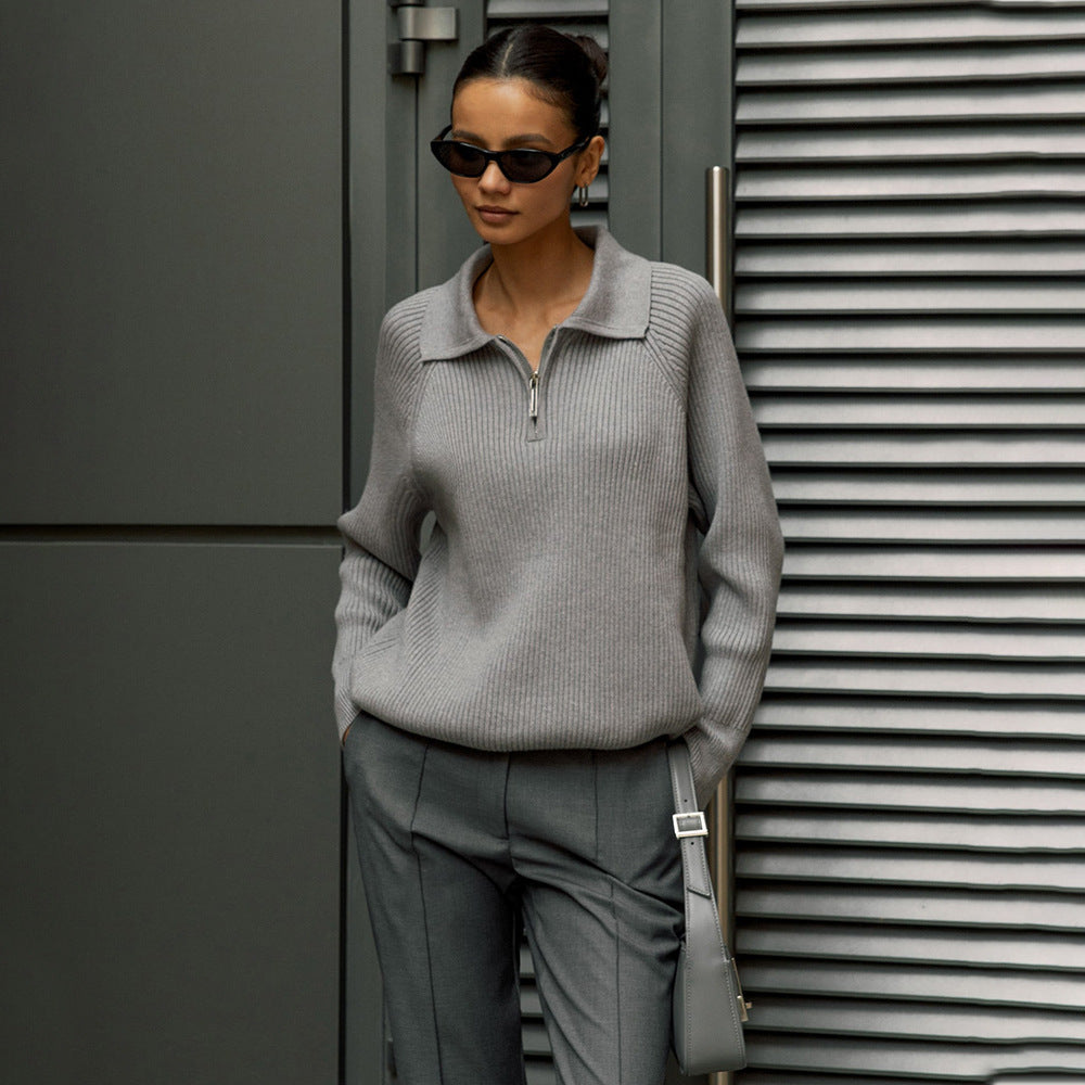 Cream-colored knit sweater for women by Christine Brewer featuring a cozy, textured design and a relaxed fit.