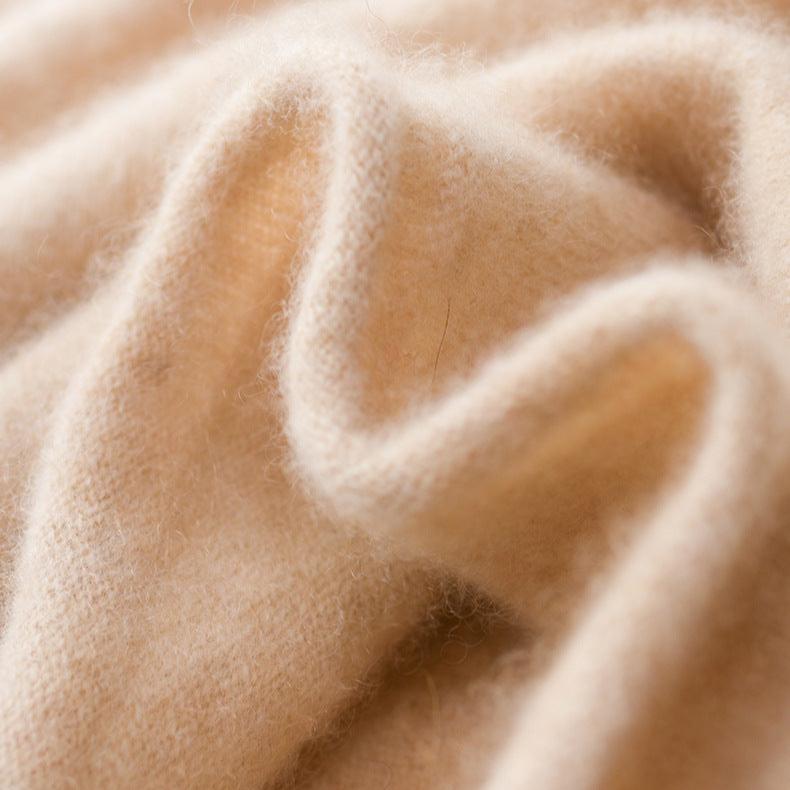Cream-colored Christine Brewer Gabrielle cashmere turtleneck sweater for women, shown on a mannequin.