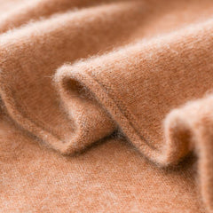 Christine Brewer Gabrielle cashmere turtleneck sweater for women, soft beige knit, close-up of cozy, stylish sweater fabric.
