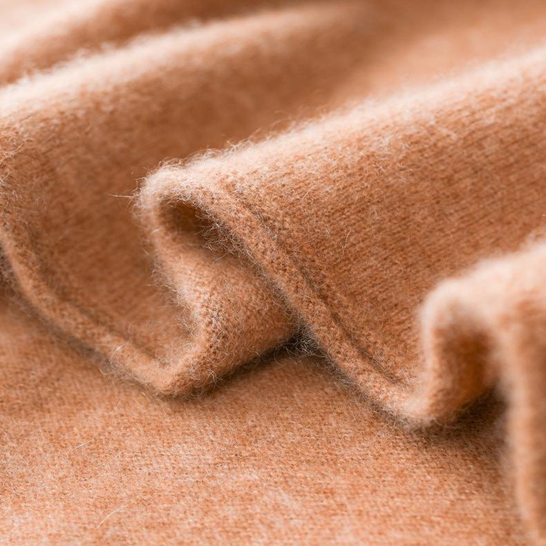 Christine Brewer Gabrielle cashmere turtleneck sweater for women, soft beige knit, close-up of cozy, stylish sweater fabric.