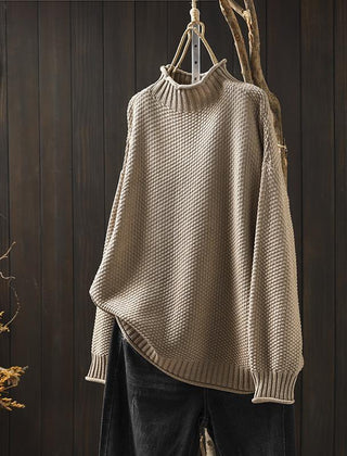 Cream-colored knit sweater for women by Christine Brewer, featuring a cozy Jade design with ribbed cuffs and neckline.