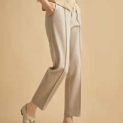 Women's wool tapered trousers by Christine Brewer, soft merino fabric, tailored fit, displayed on a neutral background.