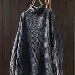 Jade green knit sweater for women by Christine Brewer, featuring a cozy, textured design and long sleeves on a model.